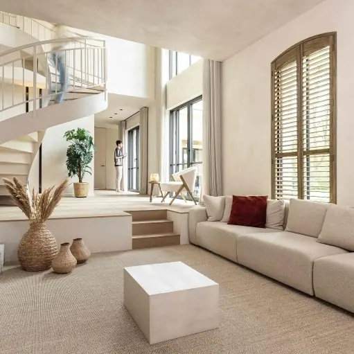 Lichte woonkamer met lange sofa. Tapijt van Tasibel.